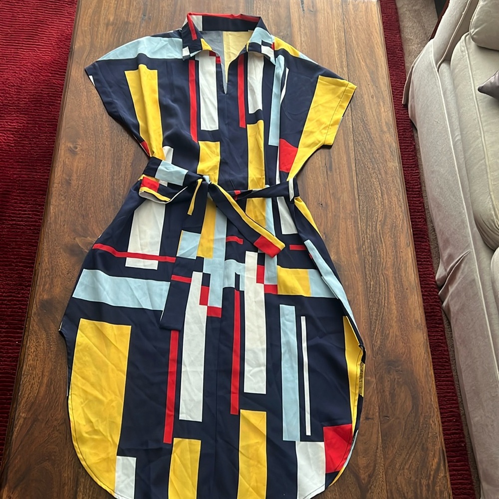 Multi color light weight dress. No tags. Fits Size medium or small. Like new!
